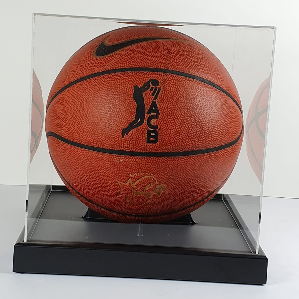 Basketball in a clear display case with a visible brand logo.