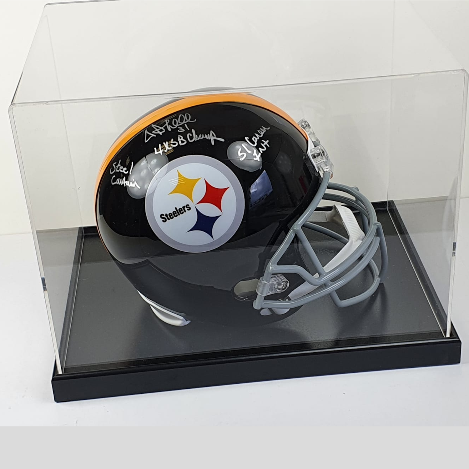 Signed Pittsburgh Steelers helmet in a clear display case on a white background