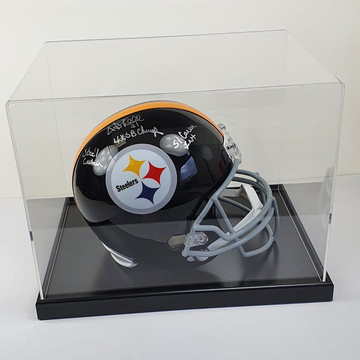 Signed Pittsburgh Steelers helmet in a clear display case on a white background