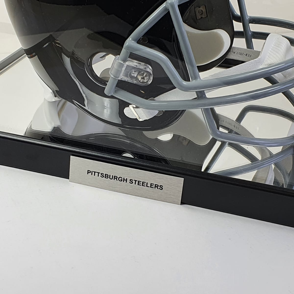 Close-up of a Pittsburgh Steelers football helmet with face mask on a white background
