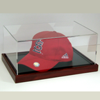 Baseball cap in acrylic display case with wood base