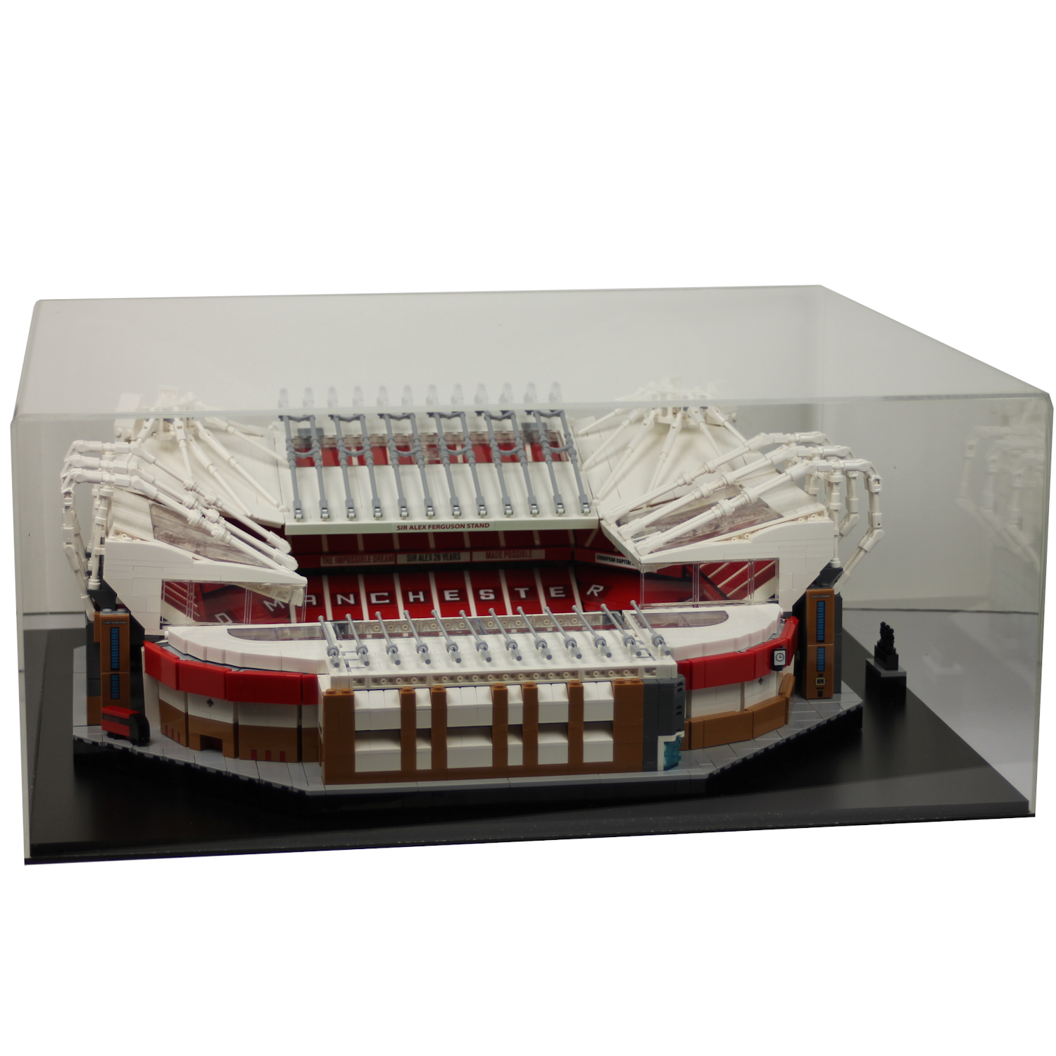 Model of Old Trafford stadium made from Lego building blocks in a clear display case, on white background.